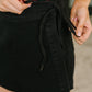 Bentli High Rise Side Tie Denim Skort in Black