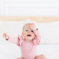Vintage Pink Long Sleeve Flutter Bodysuit