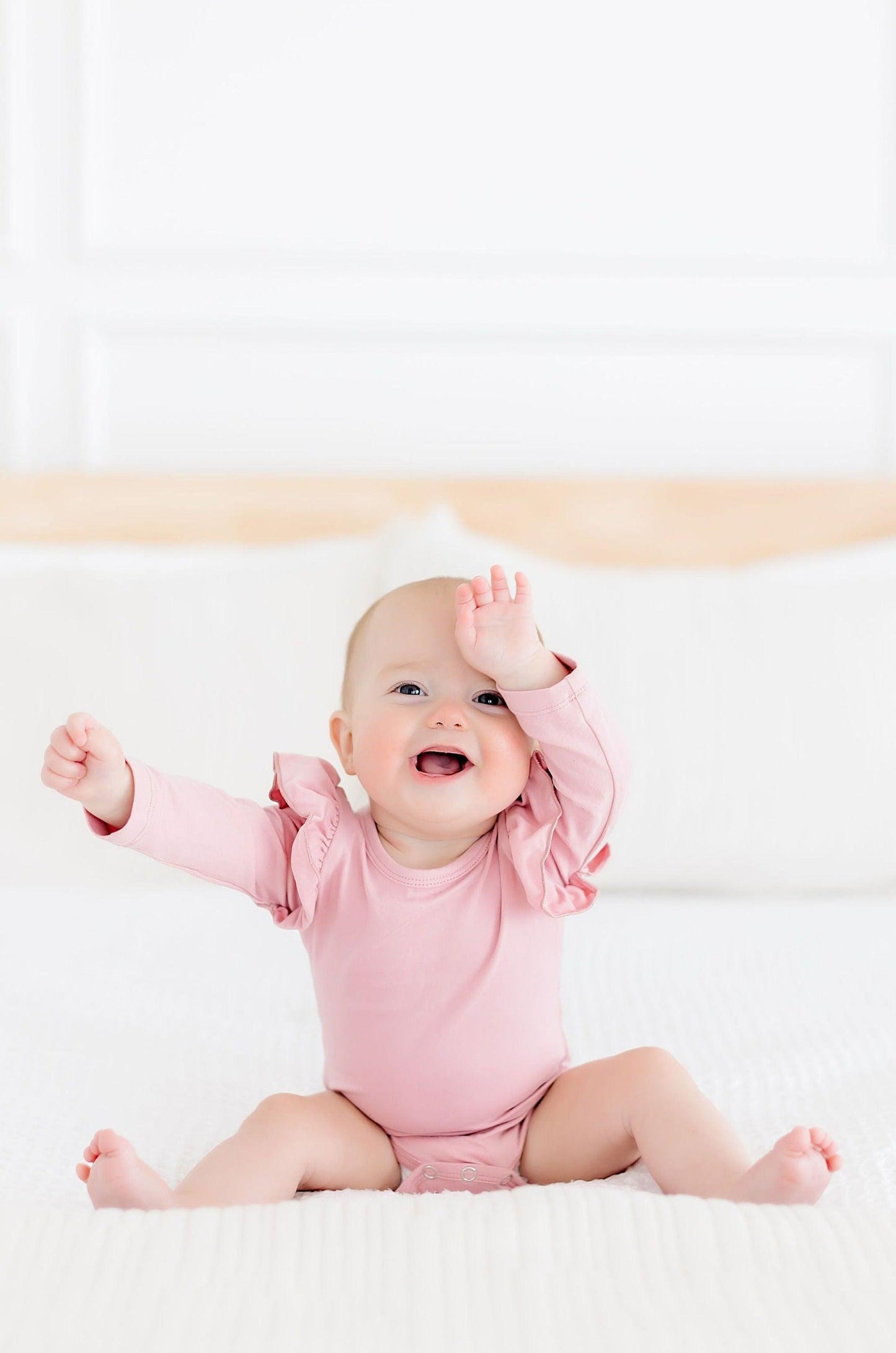 Vintage Pink Long Sleeve Flutter Bodysuit