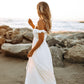 Odella Off Shoulder Dress: Smocked Maxi in Off White